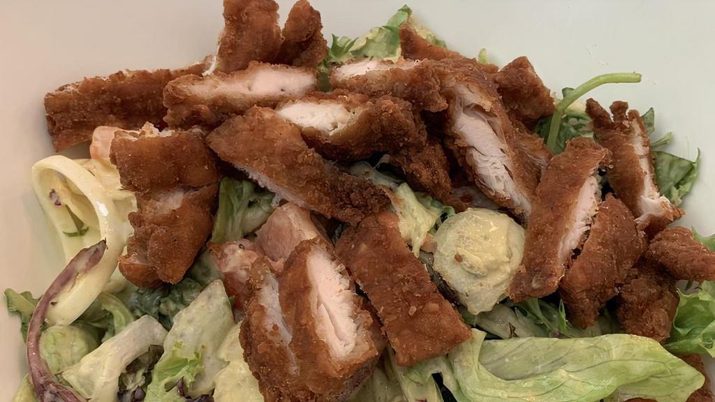 Fried Chicken Salad · Bite-size chicken fingers on a bed of salad greens with cheddar cheese, diced tomato and egg. Served with honey mustard dressing.