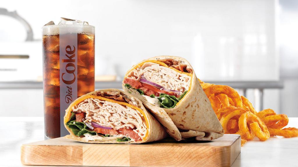 Roast Turkey Ranch & Bacon Wrap Meal · Premium sliced turkey breast with pepper bacon, cheddar cheese, green leaf lettuce, tomato, red onion and parmesan peppercorn ranch sauce in a hearty grain wrap. Visit arbys.com for nutritional and allergen information.