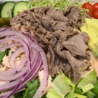 Grilled Tri Tip Salad · Fresh green salad topped with our seasoned grilled Tri Tip