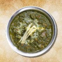 Spinach & Goat Curry  · Tender chunks of marinated goat, slow cooked in a thick onion, ginger, garlic and spinach cu...