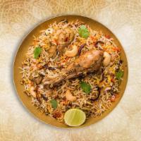 Classic Chicken Biryani · Long grained rice flavored with fragrant spices flavored along with saffron and layered with...