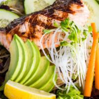 Grilled Salmon · Charbroiled salmon, sliced cucumbers and avocado served top spring greens mixed with sesame ...