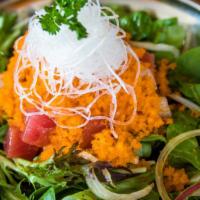 Spicy Seafood Salad · Raw tuna, salmon, and albacore diced and served atop spring greens mixed with masago and a s...