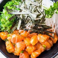 Salmon Poke Bowl · Fresh salmon mixed in a Hawaiian poke dressing topped with green onions, served with seaweed...