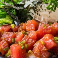 Tuna Poke Bowl · Fresh tuna mixed in a Hawaiian poke dressing topped with green onions, served with seaweed s...