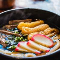 Beef Udon · Udon noodles, aburaage, fish cake, and beef topped with green onions and seaweed, served in ...