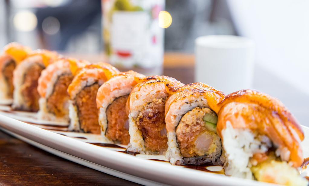 Samurai Roll · In: Shrimp tempura, Spicy tuna and cucumber
Top: Seared salmon, eel sauce and spicy mayo