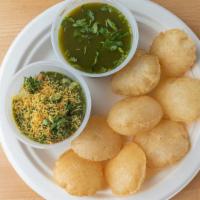 Panipuri · Crisp wheat and lentil puffed nuggets with veggie filling and masala dipping sauce.