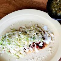 Huaraches (W/Meat / Con Carne) · Huarache with meat: Pinto beans, sour cream,  fresh cheese,  cabbage with choice of meat.
