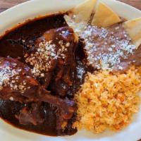 Mole Rojo · Red Mole comes with red rice, pinto beans and choice tortillas (arroz, frijoles, tortillas)