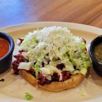 Sopes (W/Meat / Con Carne) · Sope with meat: Pinto beans, sour cream, fresh cheese, lettuce and choice of meat.