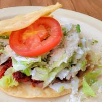 Tostadas · Comes with  beans , lettuce  , sour cream  , fresh cheese  , slice of tomato and choice of m...