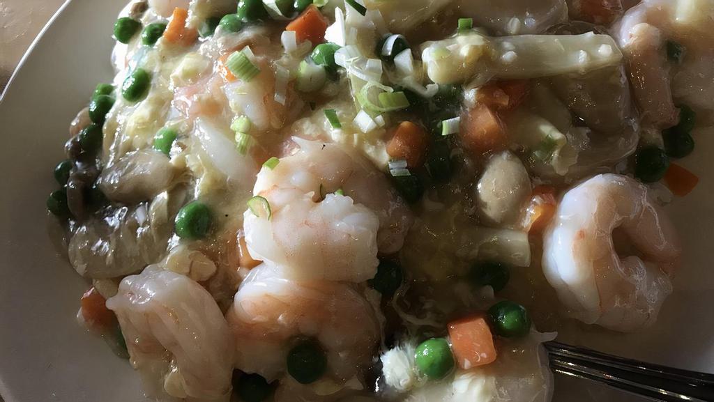 Shrimp With Lobster Sauce Over Rice · Sauteed shrimp in a white garlic and egg lobster sauce with peas, carrots, and mushrooms served over steamed rice.
Contains: egg.
