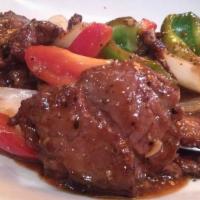 Black Pepper Steak · Hot & spicy. Filet Mignon sauteed in a sweet black pepper sauce with bell peppers and onions.