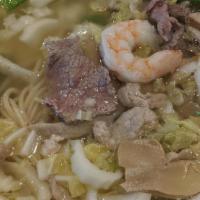 Deluxe Noodle Soup · Served with chicken, beef, pork and shrimp. Snow peas, cabbage, and mushrooms in a clear bro...