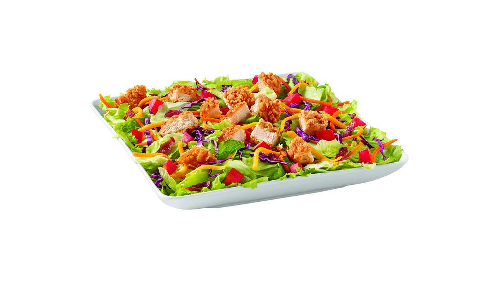 Crispy Chicken Blt Salad · Served with your choice of Marzetti® dressing and topped with crispy chicken, chopped tomatoes, crispy bacon crumbles, shredded cheddar cheese, red cabbage, and shredded carrots.