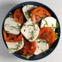Caprese Salad · Romaine & Iceberg Lettuce, Marinated Tomato, Fresh Mozzarella, Basil.