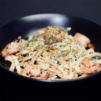 Shrimp Scampi · 6pcs large shrimp, garlic, white wine lemon sauce, butter, parsley, fettucine.