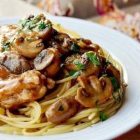 Chicken Marsala · 2pcs chicken cutlet, mushrooms, garlic, marsala wine sauce, parsley, spaghetti.