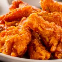 The Buffalo Wings · Crispy chicken wings smothered in a spicy Buffalo sauce and fried to perfection with a side ...