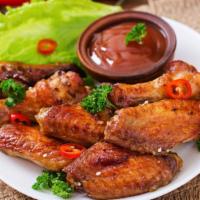 Teriyaki Wings (6 Pieces) · Golden, fried, crispy on the outside, juicy on the inside wings glazed with tangy and sweet ...
