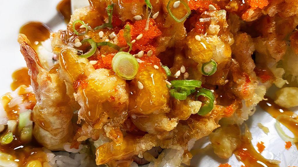 The Miyoshi (Craw Fish / Pop Corn Baby Lobster) · In: shrimp tempura, crab, avocado, cucumber roll topped w/ fried crawfish, teriyaki, green onion & masago.