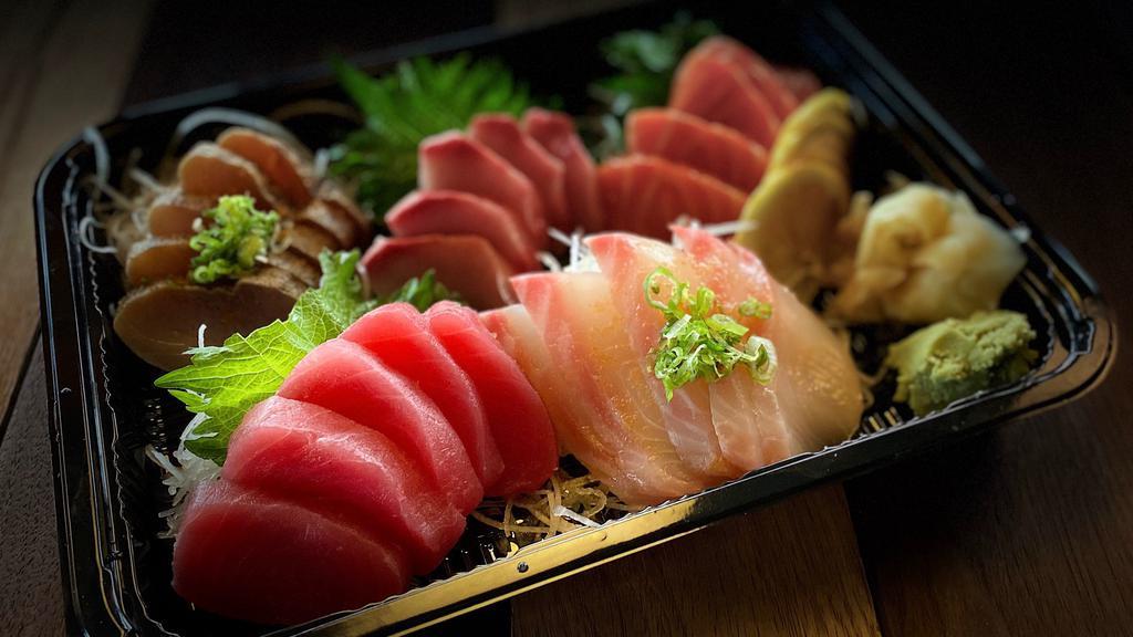 Sashimi Deluxe · Fresh Tuna, Salmon, YellowTail, and Chef's Choice 2 other 
Total 25 pcs Fresh Cut Sashimi
