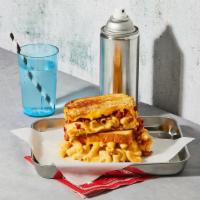 The Mac Attack · Gooey mac and cheese and turkey bacon bits grilled between two slices of buttered bread.