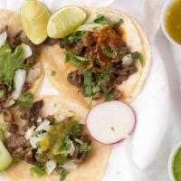Tacos · Delicious Tacos that includes your choice of meat, onion, and cilantro.