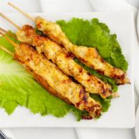Satay Chicken · Marinated in coconut milk with herbs and spices, grilled and served with peanut sauce and cu...