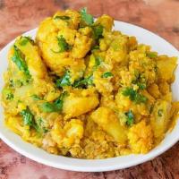 Aloo Gobi Masala · Cauliflower and potatoes steamed and cooked with ground tomatoes, onions, ginger, garlic, an...