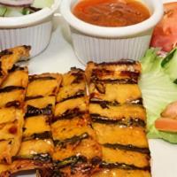 Satay · Marinated chicken or beef grilled served with peanut sauce and cucumber salad