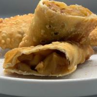 Apple Pie Empanada · Apples, Cinnamon, Nutmeg + Miyokos Vegan Butter stuffed in pastry dough