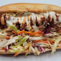 T-Dog · One tender inside a hot dog bun top with coleslaw, house sauce, and ranch