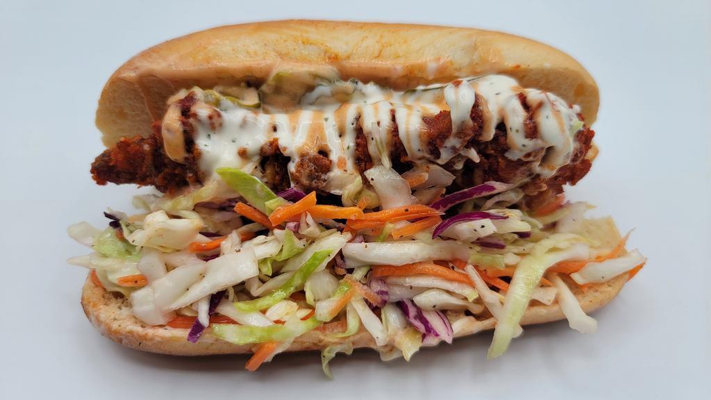 T-Dog · One tender inside a hot dog bun top with coleslaw, house sauce, and ranch