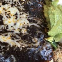 Burrito Poblano Burrito · Choice of meat. Served with rice, beans, onions, cilantro, lettuce, and salsa. Topped with r...