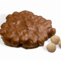 Milk Macadamia Bear · Chewy caramel and macadamia nuts covered in rich milk chocolate. Each