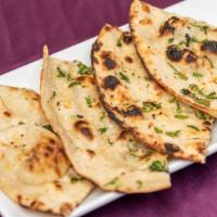 Garlic Naan · Indian oven baked flatbread.