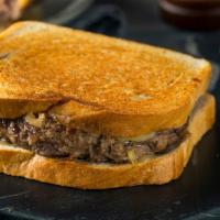The Patty Melt Sandwich · Two juicy hamburger patties, cheese, grilled onions, mustard and pickles.