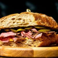 The Pastrami Sandwich · Fresh pastrami, pickles and mustard.