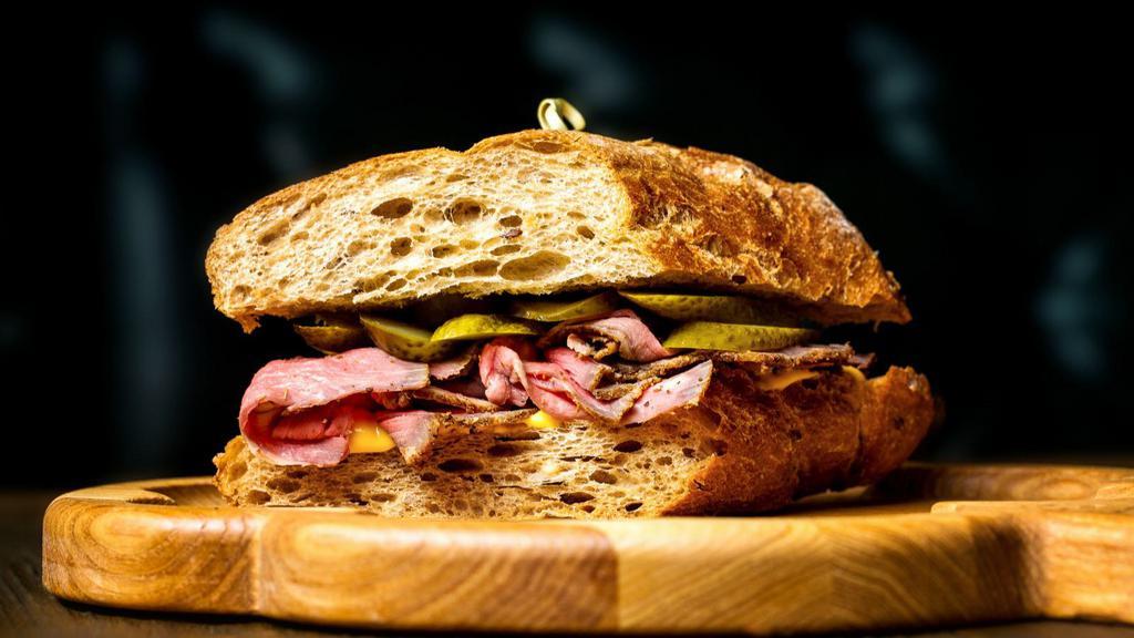 The Pastrami Sandwich · Fresh pastrami, pickles and mustard.