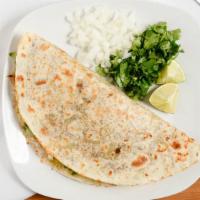 Quesadillas · Large flowered tortilla with Monterey cheese.