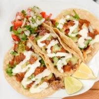 Tacos · Soft street tacos, with hand made tortillas and choice of meat, served with union and cilant...