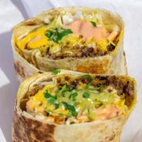 Impossible Cali Burrito · Our house seasoned Impossible Meat, guac, cheese sauce, coleslaw, and fries topped with our ...
