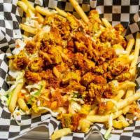 Loaded Hot Chickn Fries · Perfectly seasoned fries topped with a Nashville Hot Chickn, Secret Sauce, Guac and Vegan Ch...