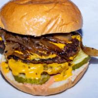 Double Smash Burger · Our specialty Double 1/4 lb smashed Impossible Burger topped with pickles,  caramelized onio...