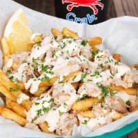 Crab Fries · Your choice of cajun or lemon pepper fries topped with real blue crab meat and drizzled with...