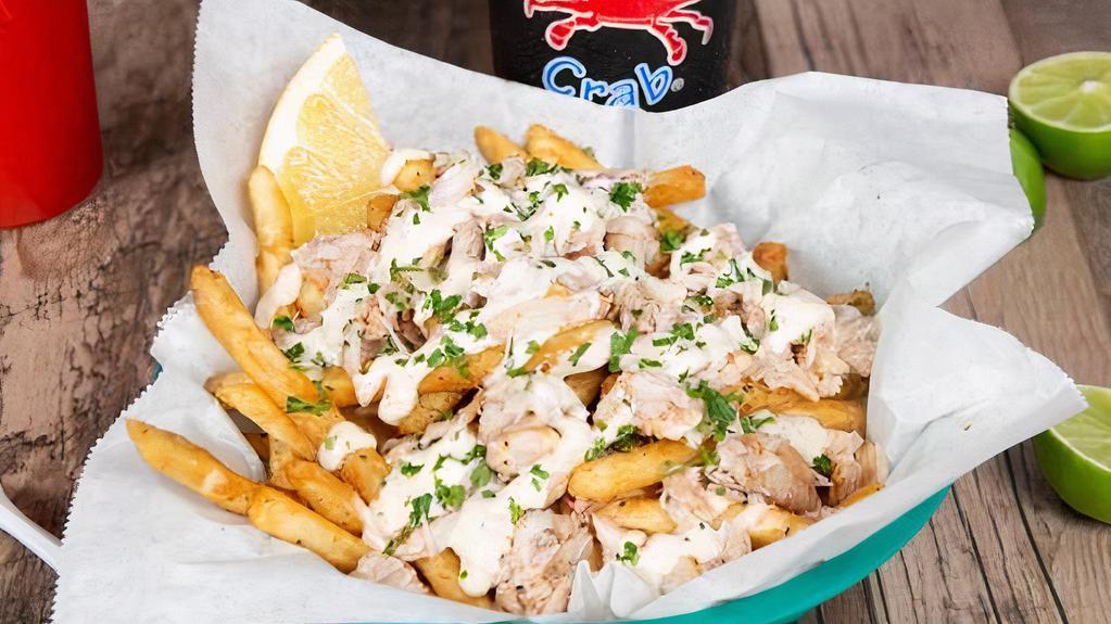 Crabber Fries · Fries topped with real blue crab meat and drizzled with our house-made garlic aioli sauce.