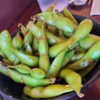 Garlic Edamame · Blanched soybeans tossed in a mixture of fresh ground garlic, sesame, soy sauce and light ch...