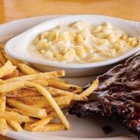 Half Rack Fall-Off-The-Bone Ribs · Our famous baby back ribs
are slow-cooked in-house for
maximum flavor